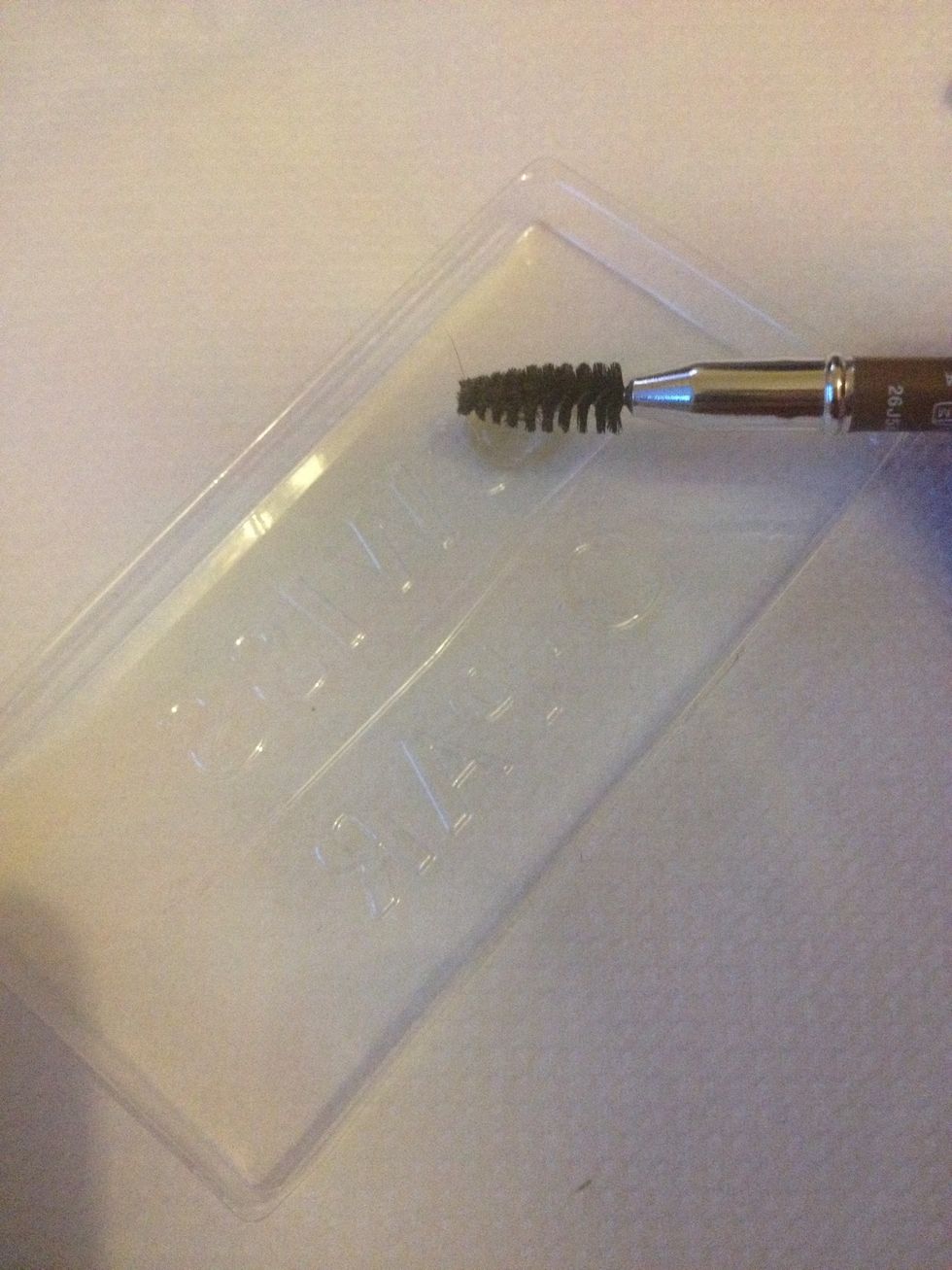 Take the end of an eye brow pencil to brush over your eyebrows.