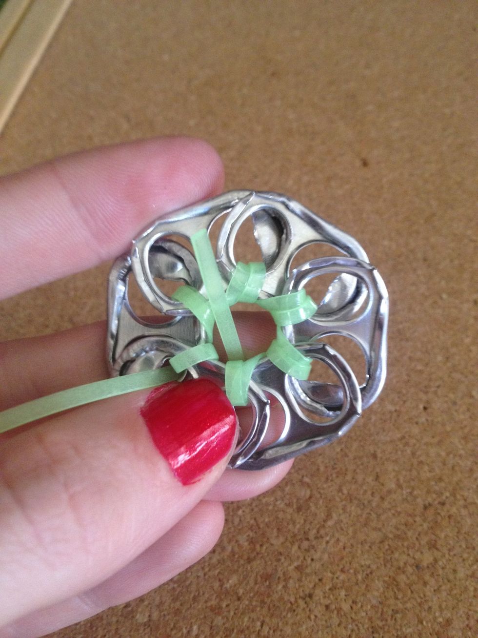 Take the ends of your material and tie two knots.