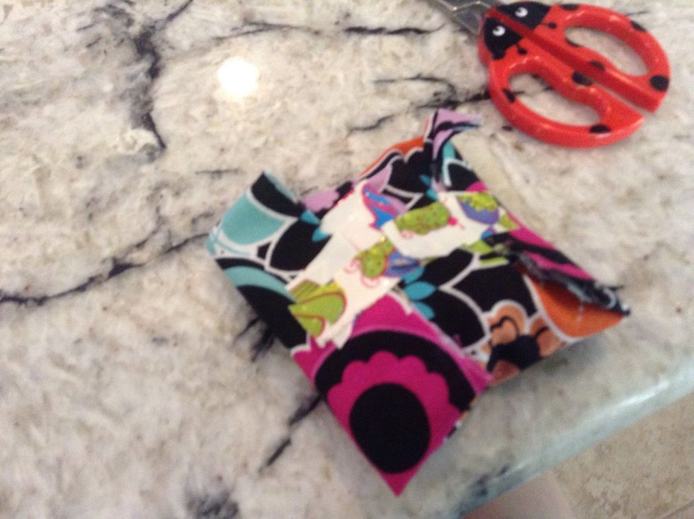 Take the ends that had the duct tape on and fold them in then take another piece of duct tape and connect the two ends together like shown above