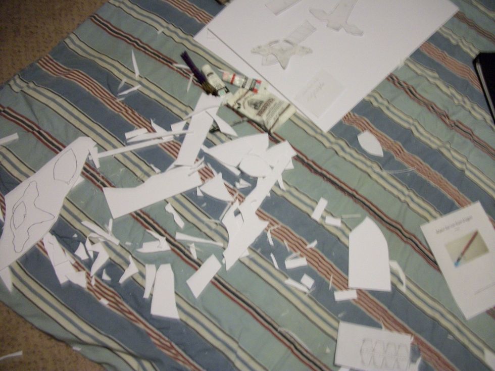 Take the exacto knife and cut the pieces out of the foam board. Making a mess