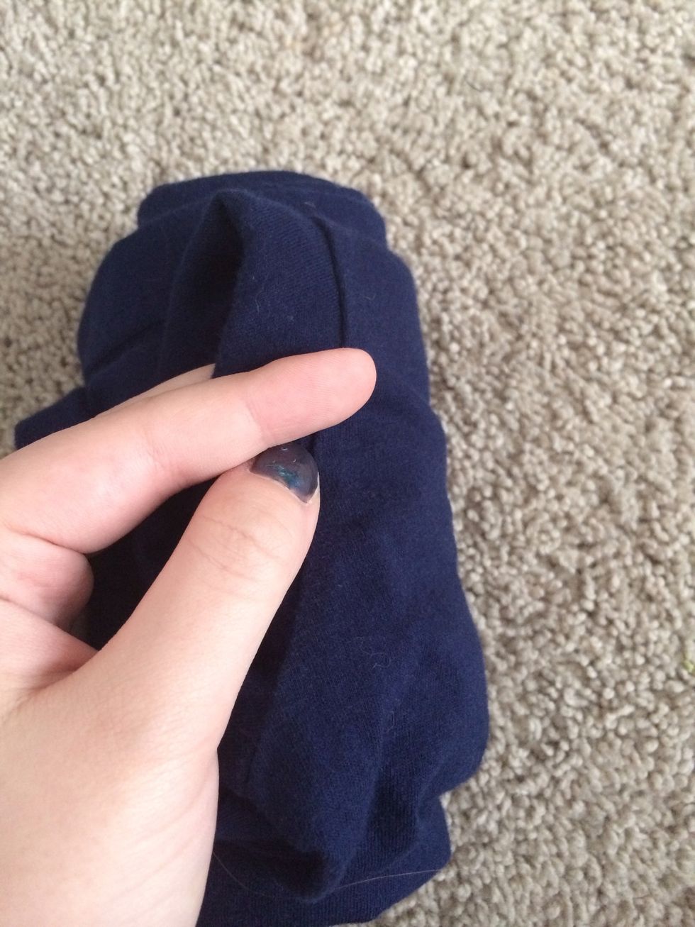 Take the first flap you see and pull it around the shirt. It may take you a few tries to master: