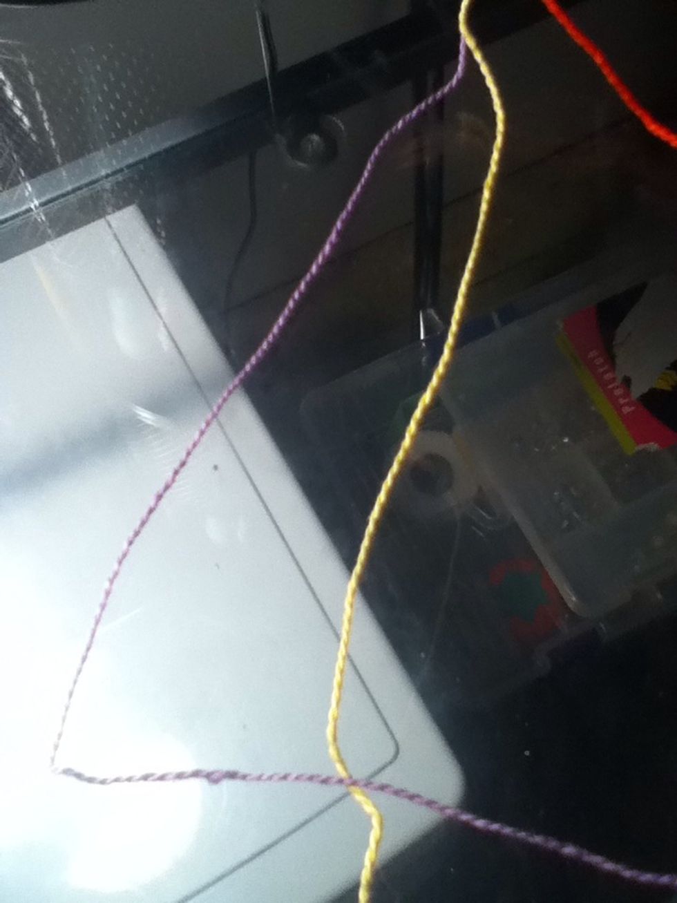 Take the first string, and make a four over the second string.