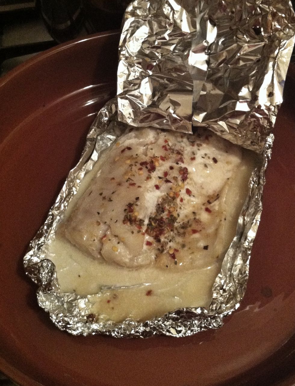 Take the fish out of the oven, and very carefully lift up a corner of the tin foil. Check if your fish is ready, and if not, put it in the oven for a bit longer.