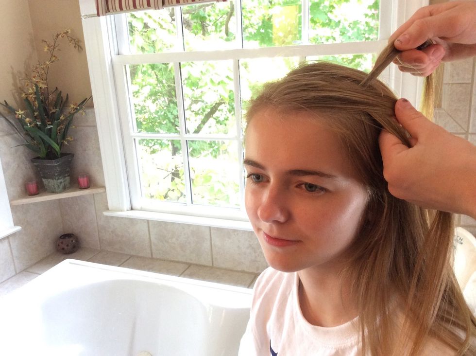 Take the front strand and cross it over the middle strand.