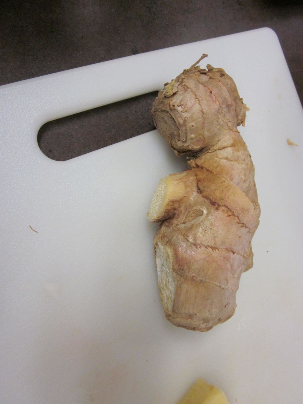 Take the ginger root and cut out about a tablespoon size off.