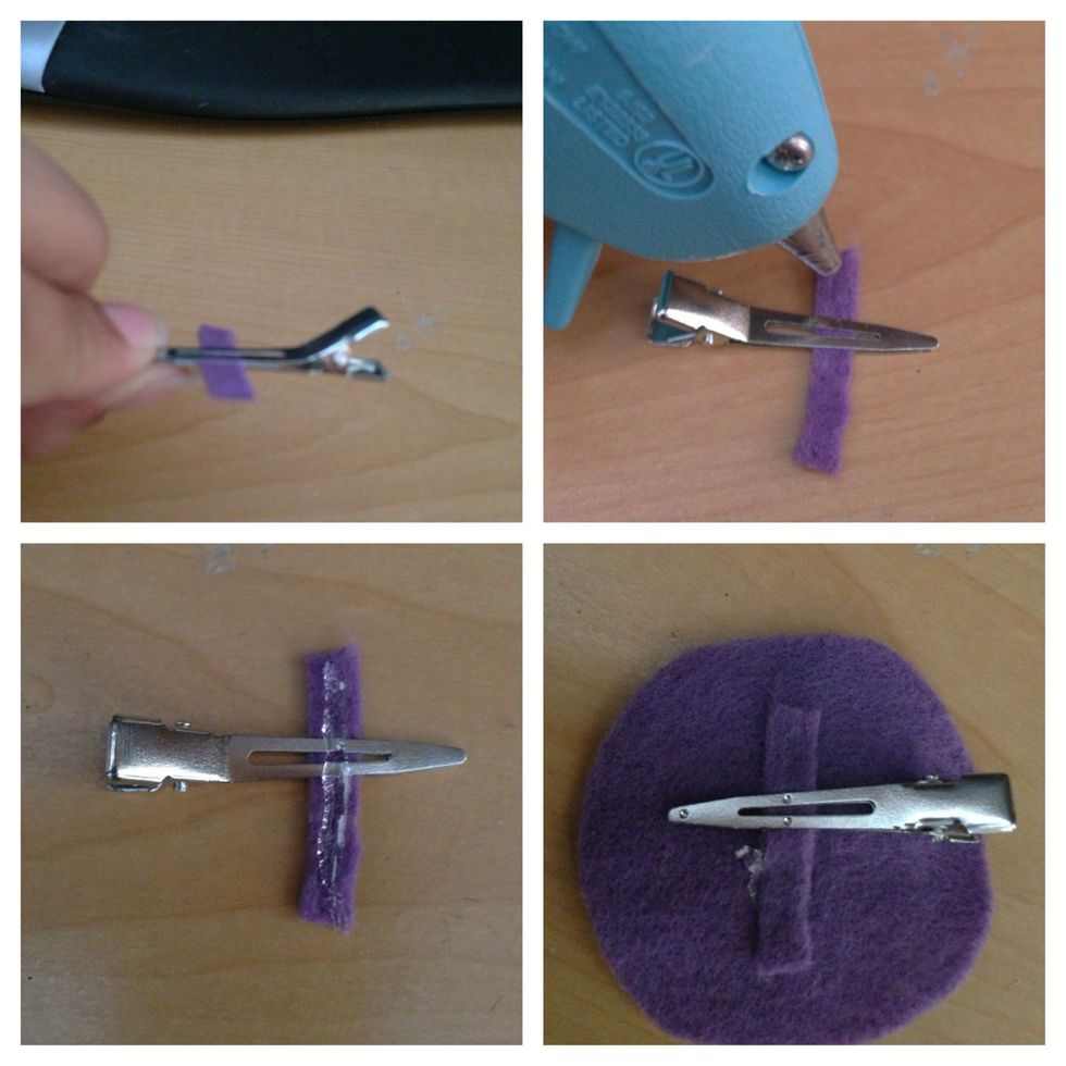 Take the hair clip and open it and place a piece of leftover felt between it, then make sure it can stay flat in a surface and place hot glue gun in top of it, now glue it to the decorated felt.