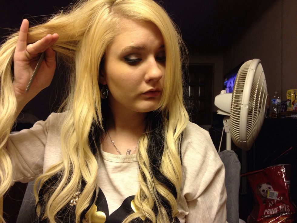 Take the half you didn't pull forward and grab it and give it a little tease/back comb