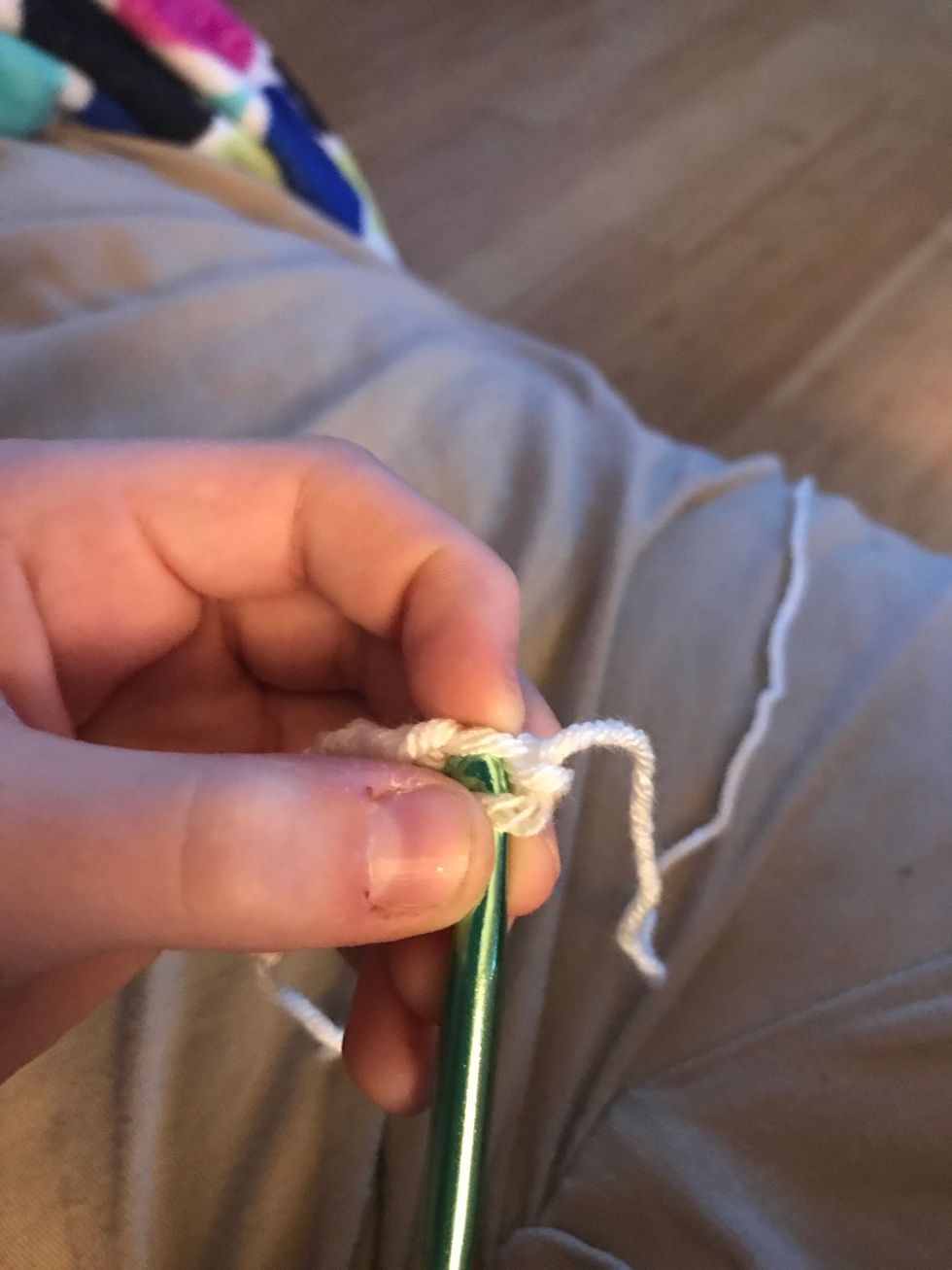 Take the head of your hook and insert it into the 9th stitch you made