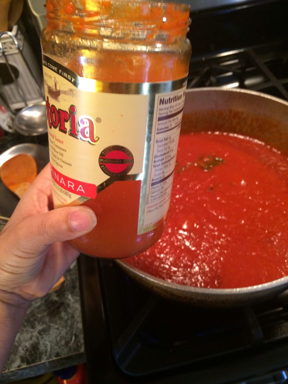 Take the jar of marinara sauce and fill it with water