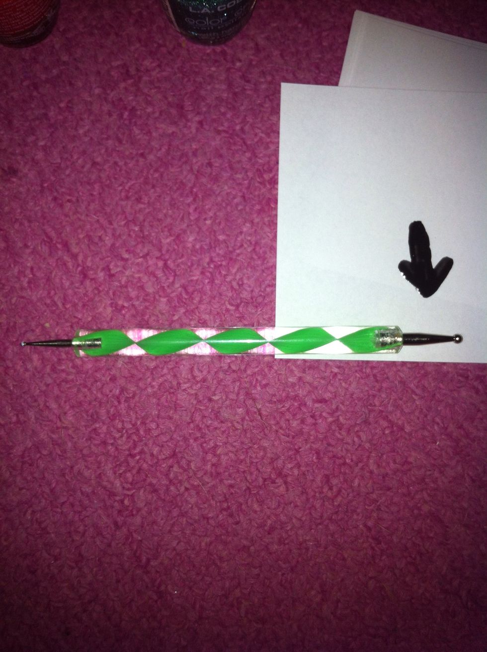 Take the largest end of the dotting tool, as shown.