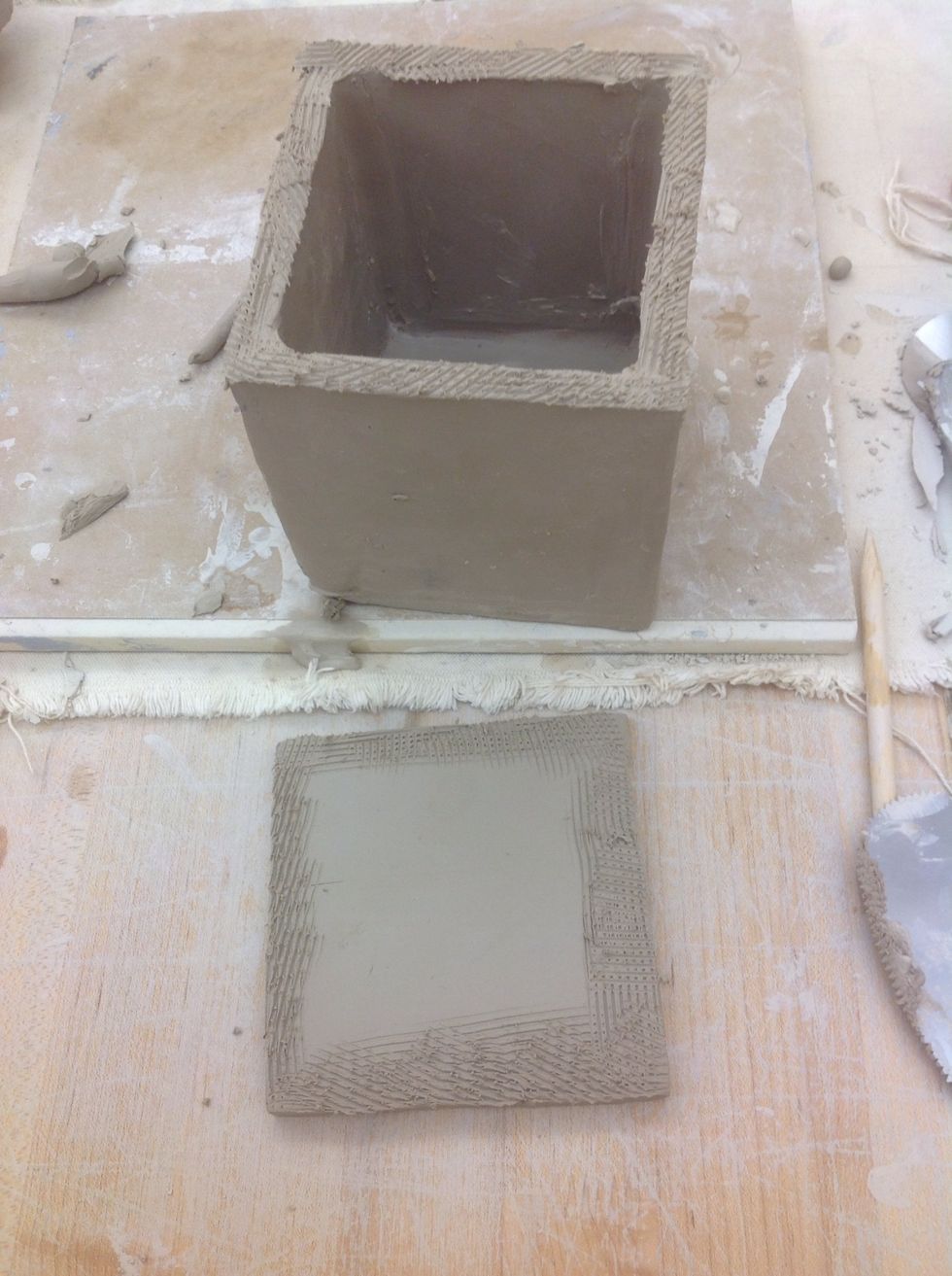 Take the last A pieces and slip and score the sides. Slip and score the edges of the box where the A piece will attach.