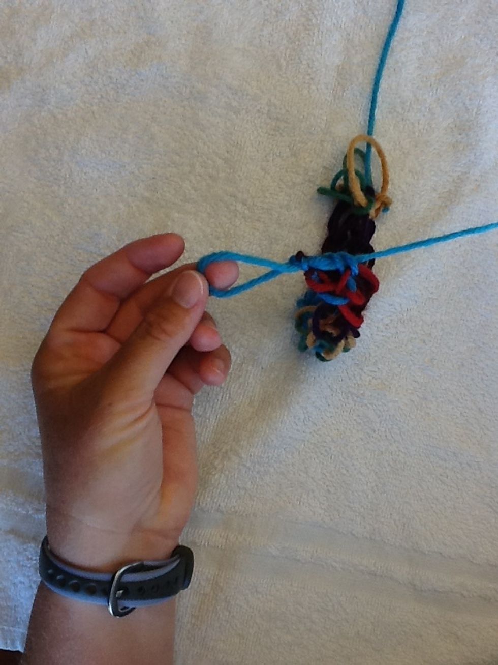 Take the last loop off your pinky finger and hold.