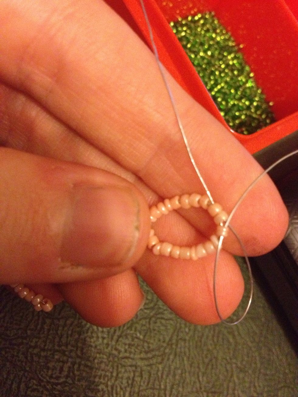 Take the left hand side wire and loop it over to the right and through a bead( from left to right ) leaving slack.