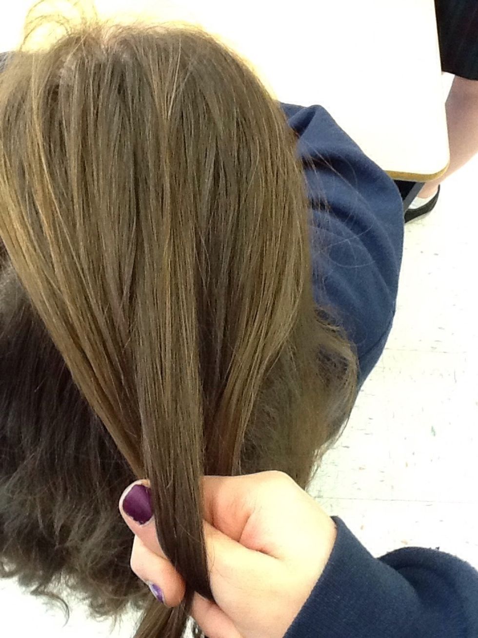 Take the left most third and cross it to the middle going under the middle strand leaving the right one alone