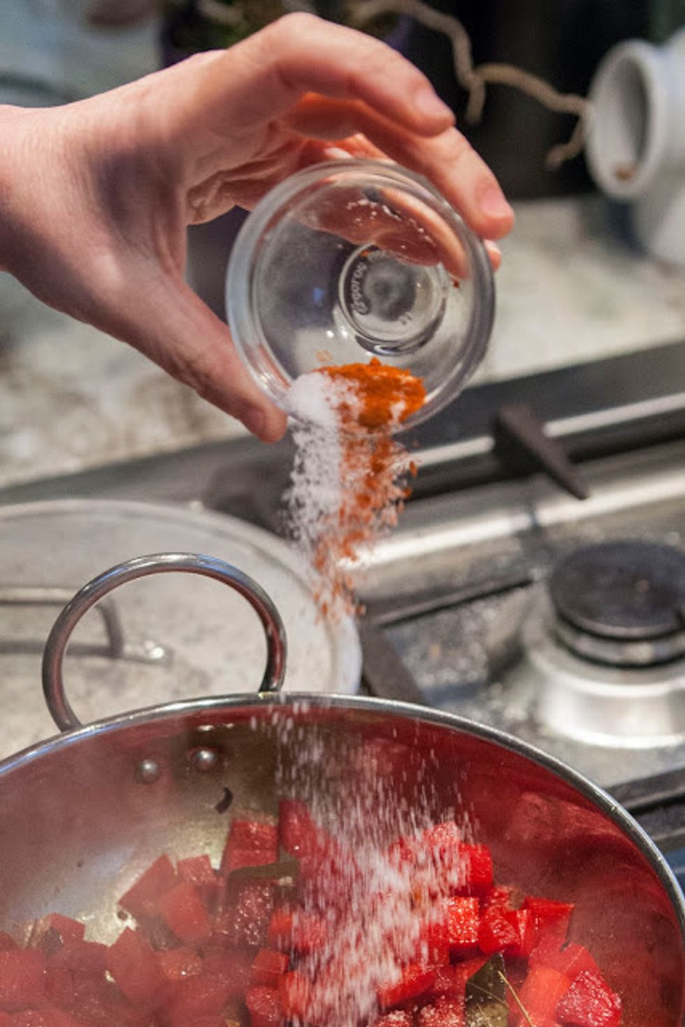 Take the lid off, give things a good stir and add in the salt and chili. Keep the lid off the pan and cook for another 5  minutes or so. Give it a good stir every now and then..