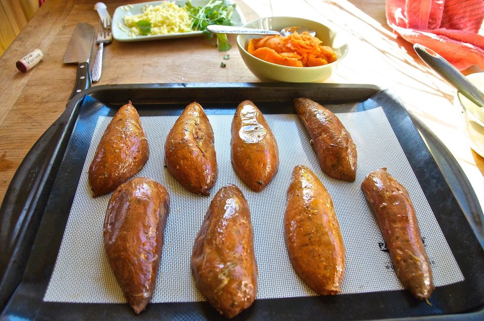 Take the lime, oil and chipotle sauce you made and brush the skins of the hollowed out potatoes halves.  Turn your oven up to 450 degrees and bake the skins for another 7-10 minutes to crisp them up.