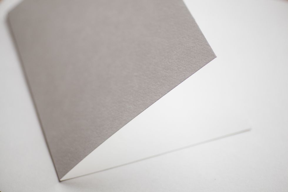 Take the list of A4 watercolor paper or cardstock and fold it in the middle.