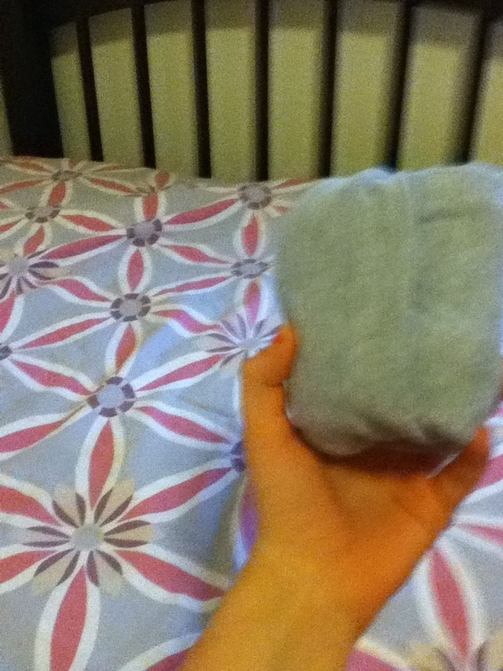 Take the little pocket thingy turn it around and fold over the rest of the shirt