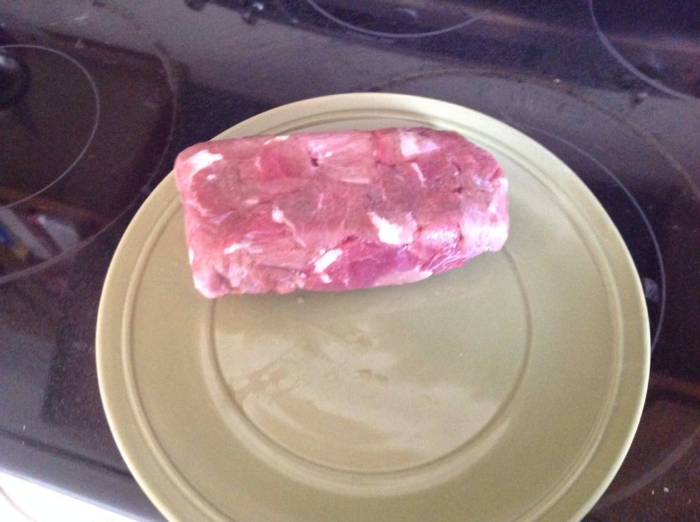 Take the meat out of the package once it is thawed.