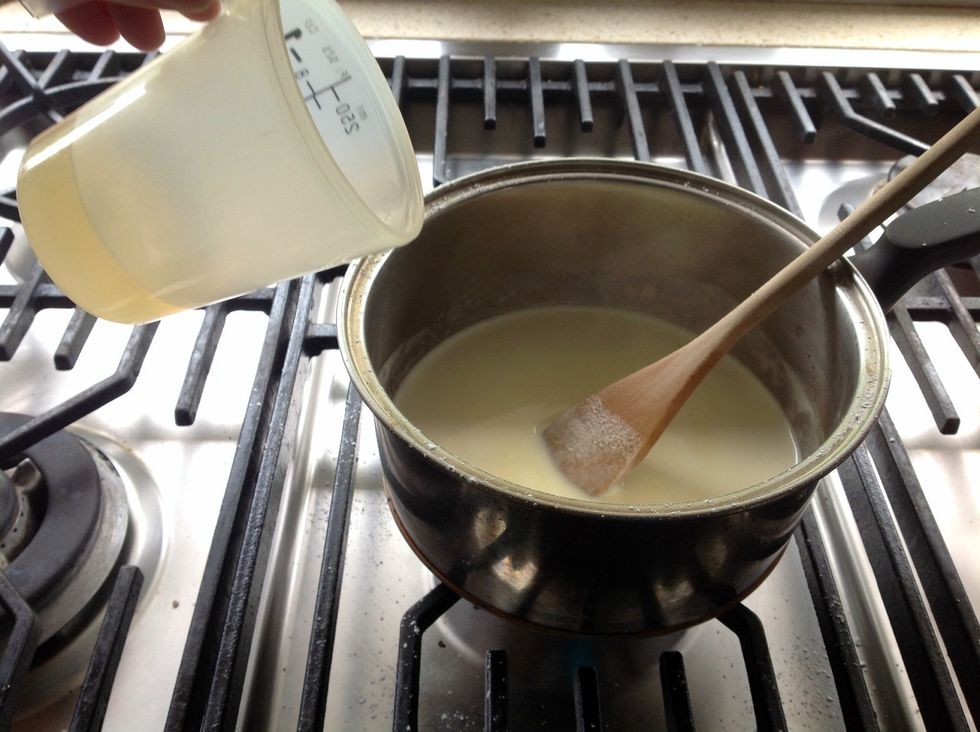 Take the mixture off heat. Add the other half of gelatine to the cream mixture and stir in.