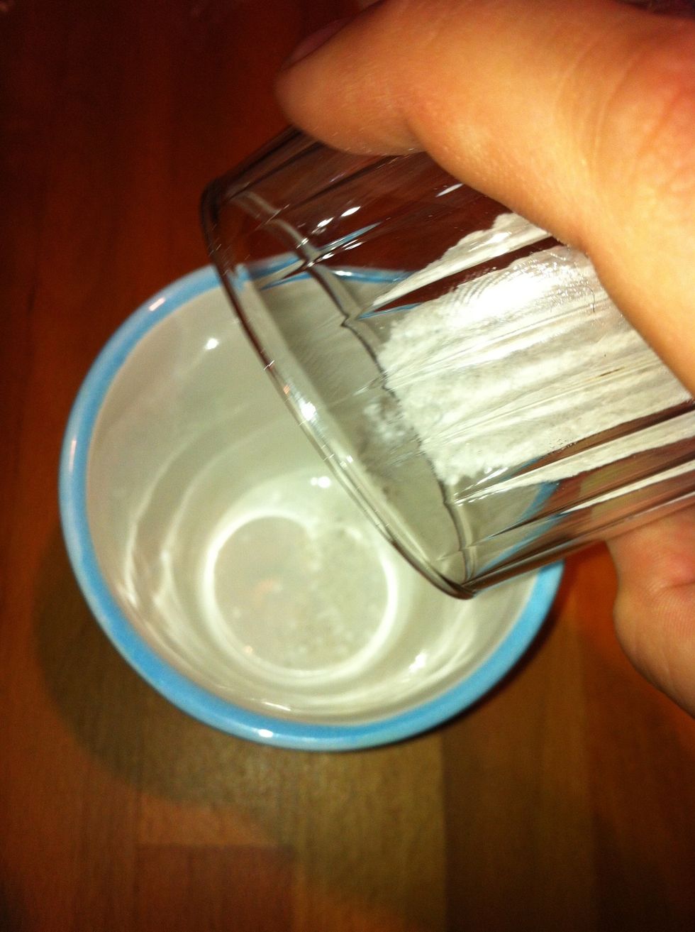 Take the mug. Add vallilia sugar and baking powder in the cup.