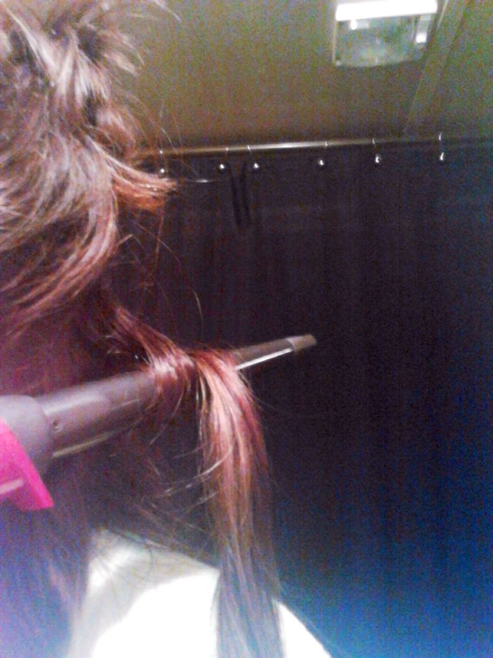 Take the next section of hair and place the wand in front of the hair. Wrap hair using the same "over and under" technique. Hold 5-10 seconds then release.