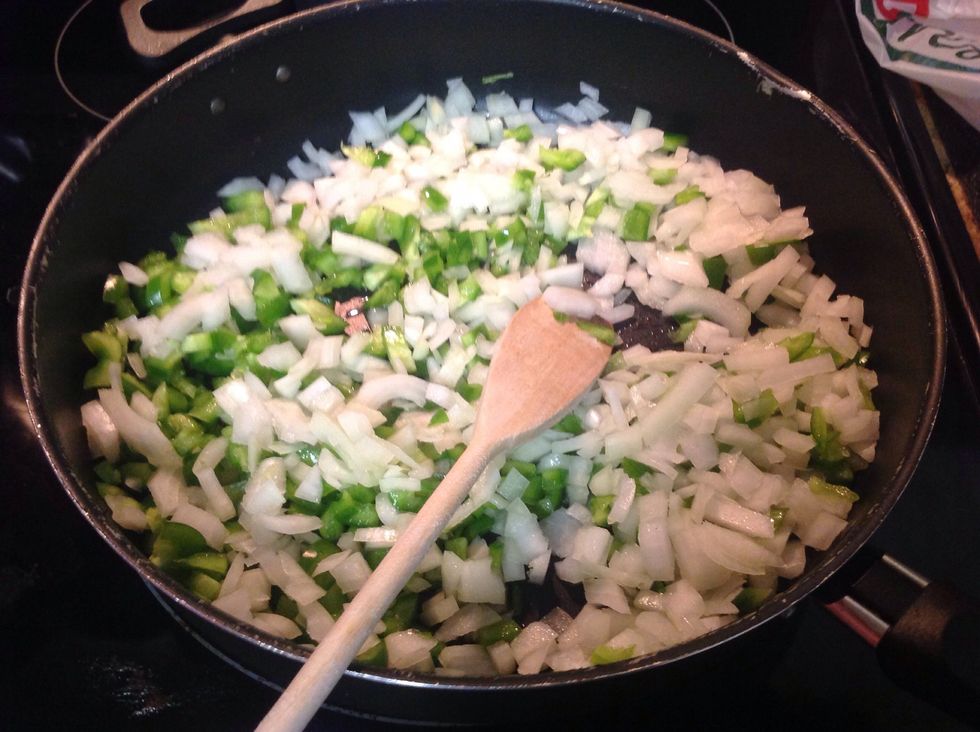 Take the onions and green pepper and put into a skillet with evoo and saut\u00e9ed until they are transparent...