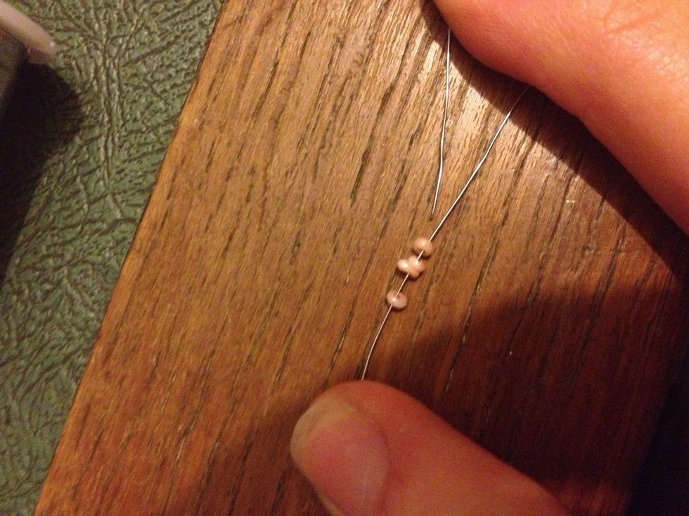 Take the opposite side of wire and thread it through the beads in the oposite direction....
