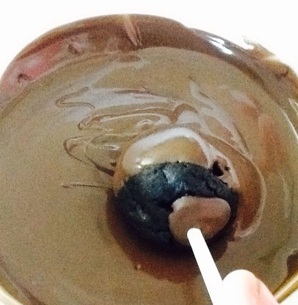 Take the Oreo balls out of the fridge/freezer and dip them in chocolate.