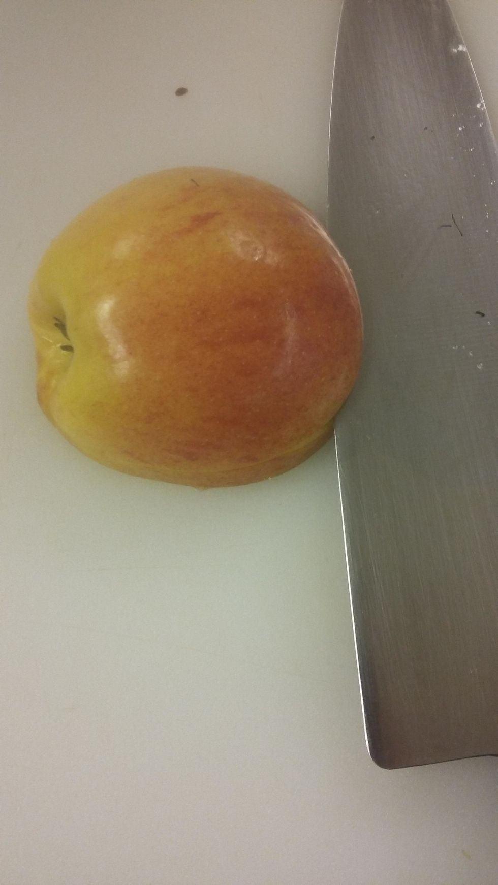 Take the other apple half and cut horizontally