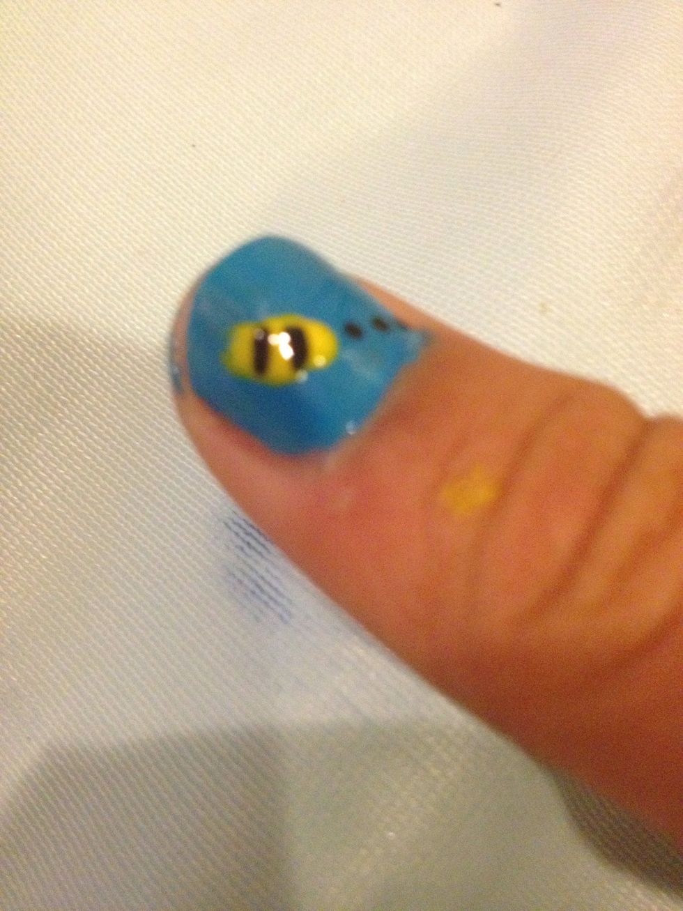 Take the other side of the the toothpick and messily (doesn't have to be perfect!) make an oval with an optional tip for the stinger