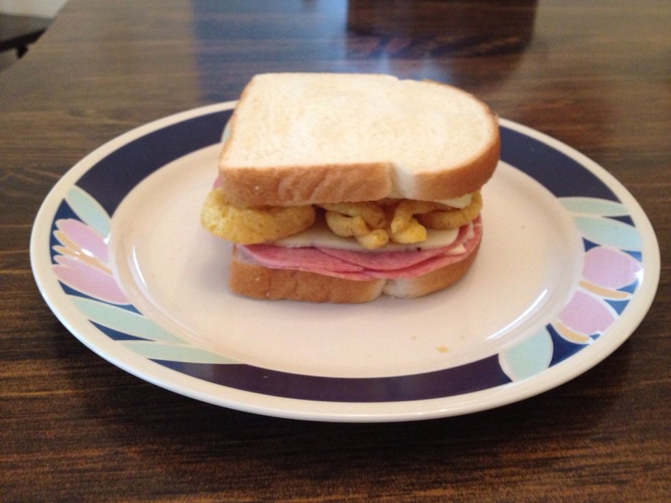 Take the other slice of bread and slightly mash it down on top to secure the Funyuns, then throw it in the microwave for about 30 seconds...