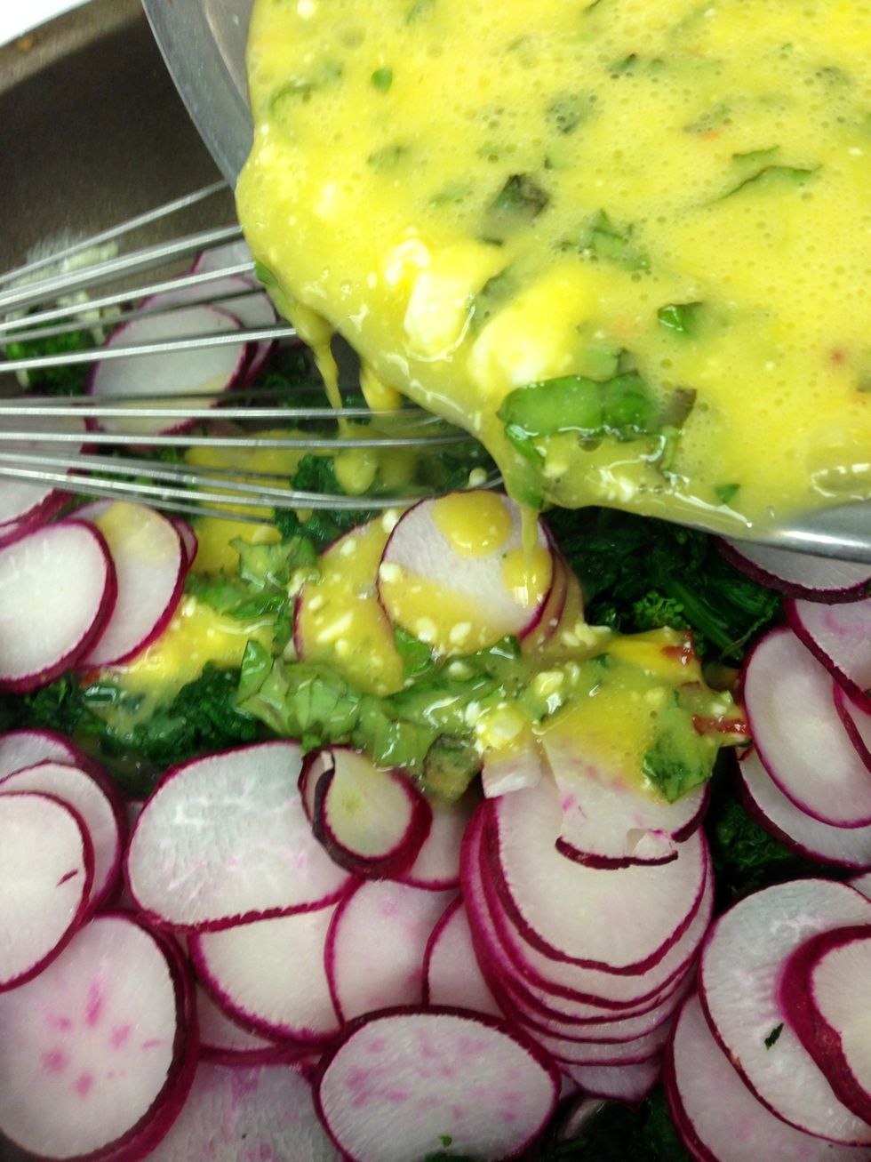 Take the pan out and stir in the egg mixture.