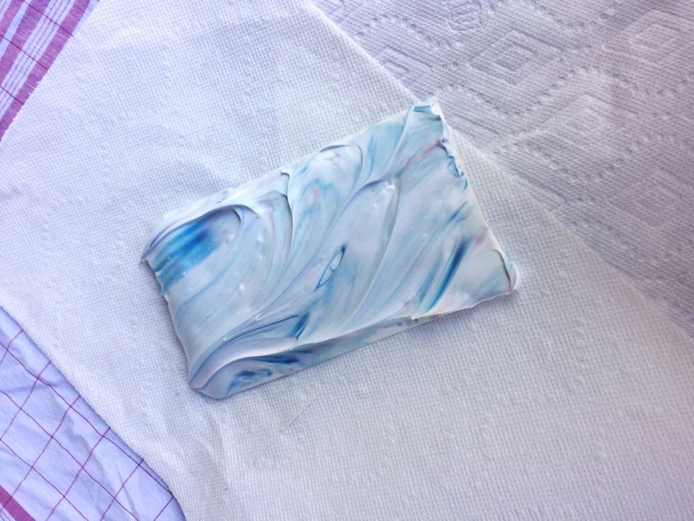 Take the paper out and place on a paper towel