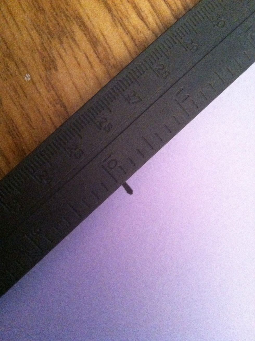 Take the piece of paper and measure it 6 inches down. (my ruler says ten inches because it's broken -__-)  Draw a line to mark the measurement.