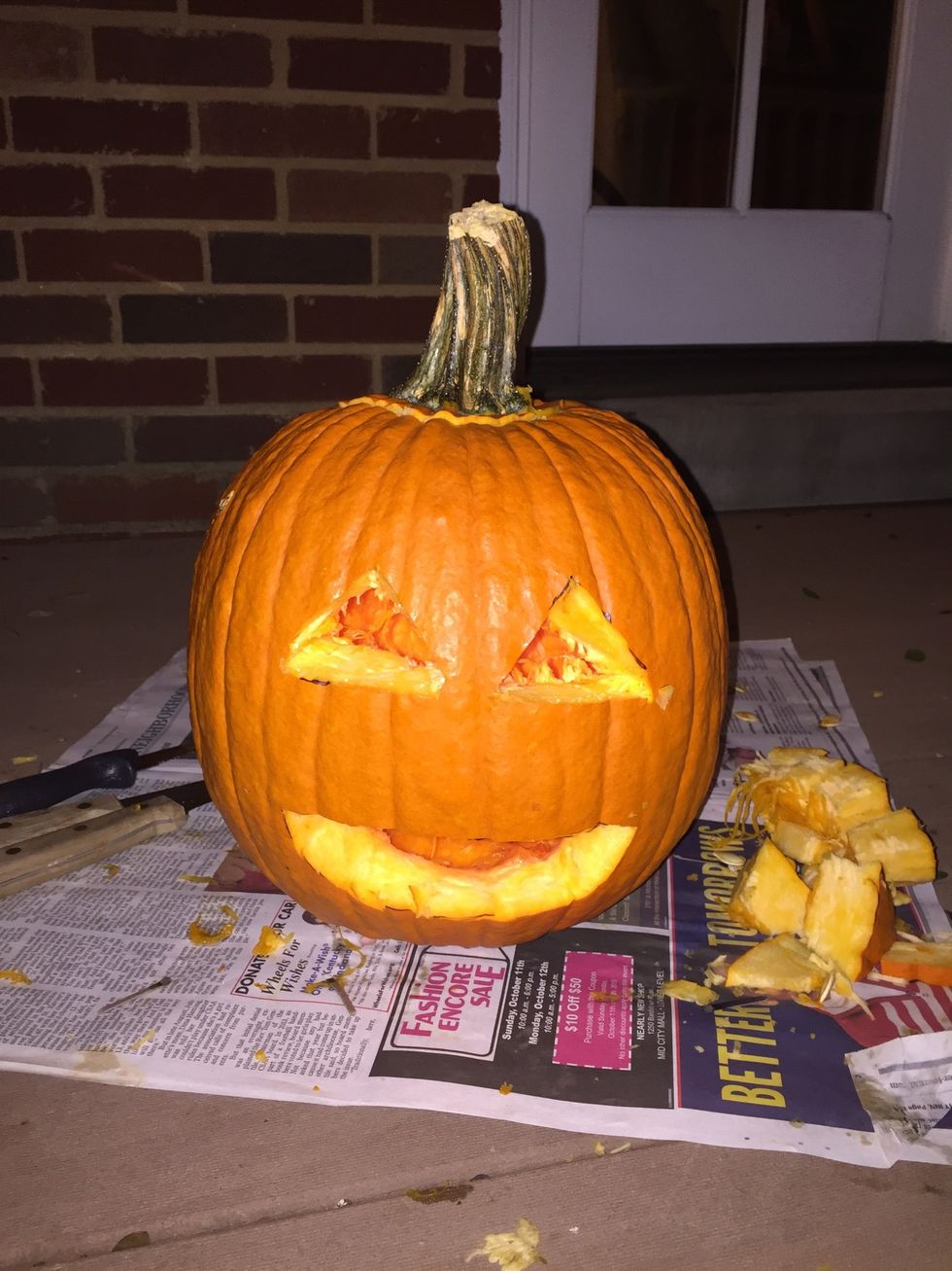 Take the piece with the stem off the top of your pumpkin, Place a small candle inside the pumpkin. Light the candle and place the top piece back on your pumpkin.