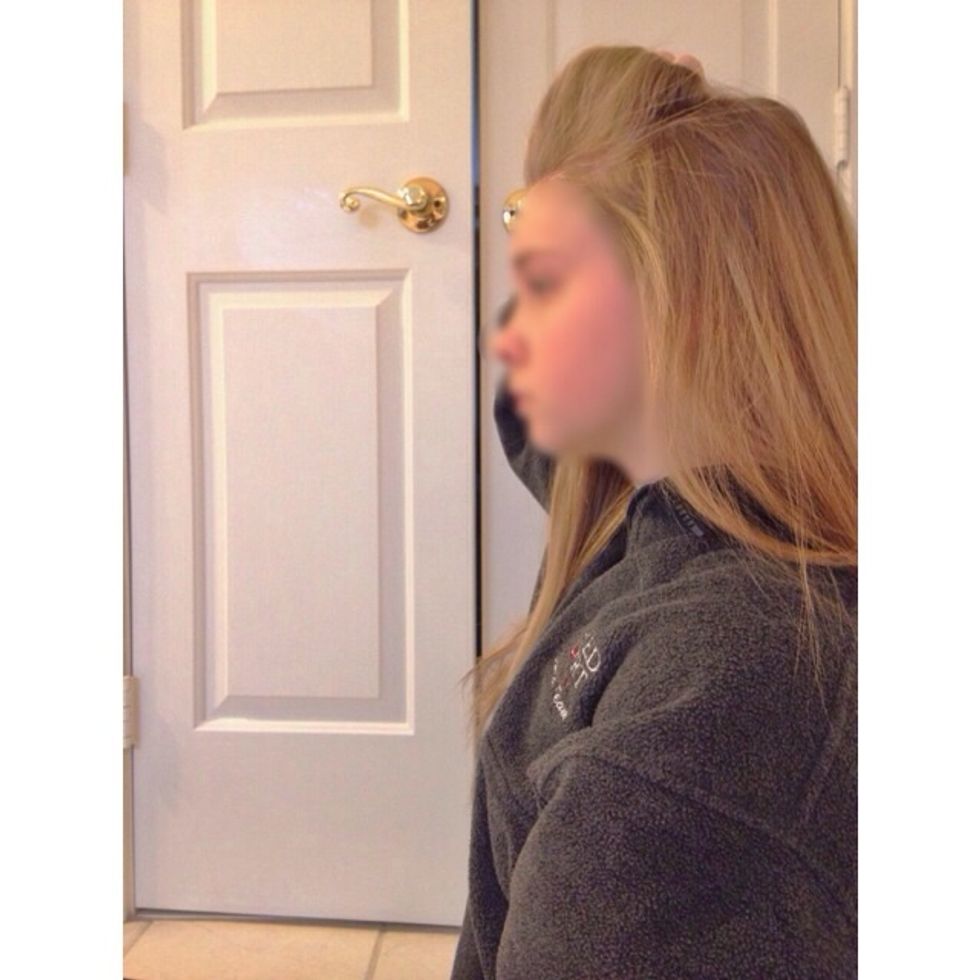 Take the pieces of hair that are still in your hand, and push them forward to create a poof.