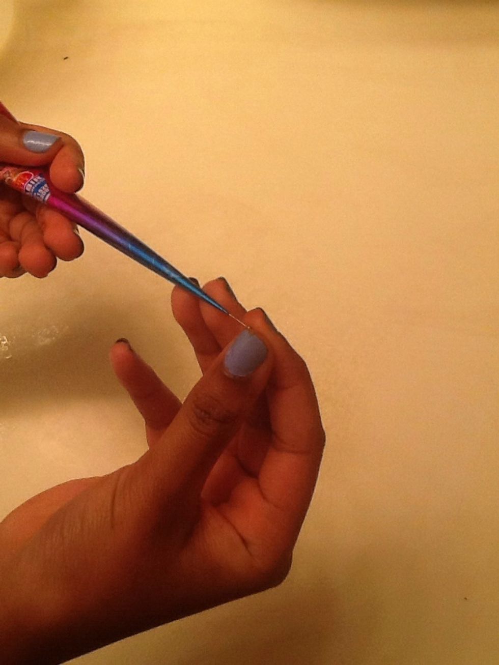 Take the pin out of the tip of the tube