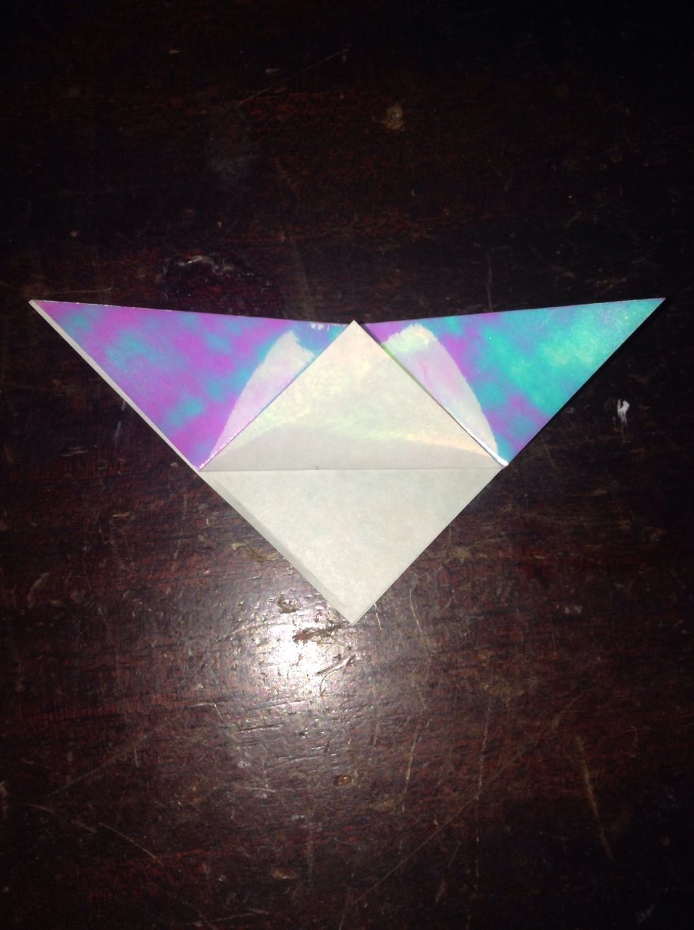 Take the point and fold it up.