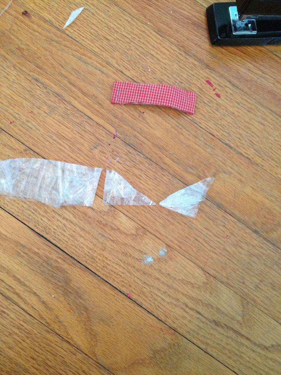 Take the pointed edge you cut off the first lower half, and cut the other pointed edge off the one that was left alone.