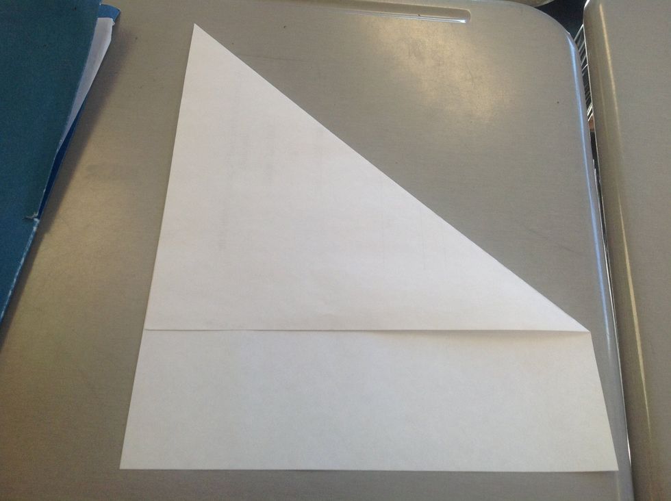 Take the printer paper and fold one end to the other edge so that the top meets that edge.