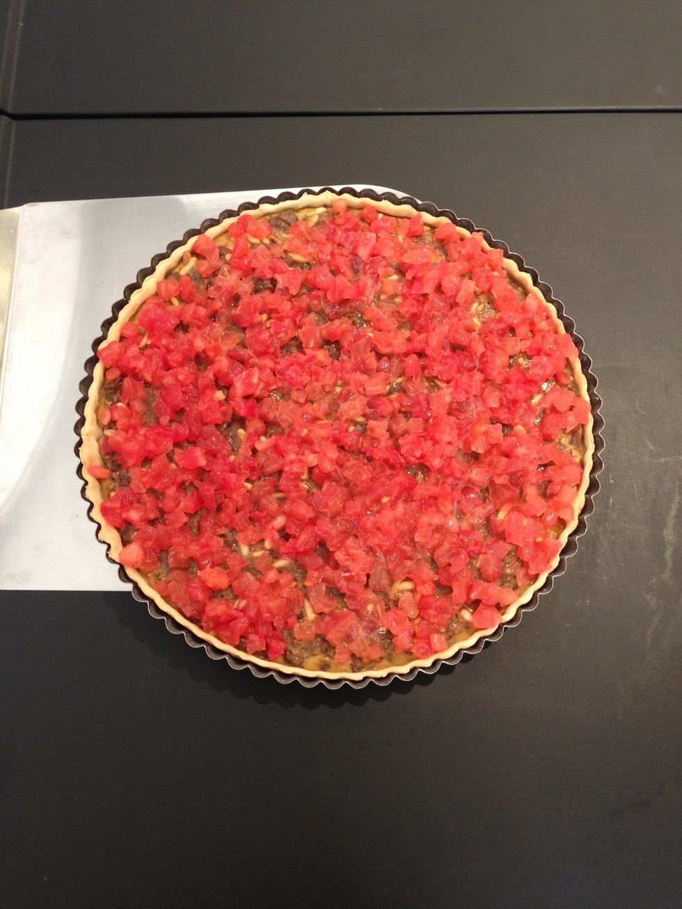 take the quiche out garnish with the diced flesh of tomatoes and put  the quiche back in the oven another 20 mins.