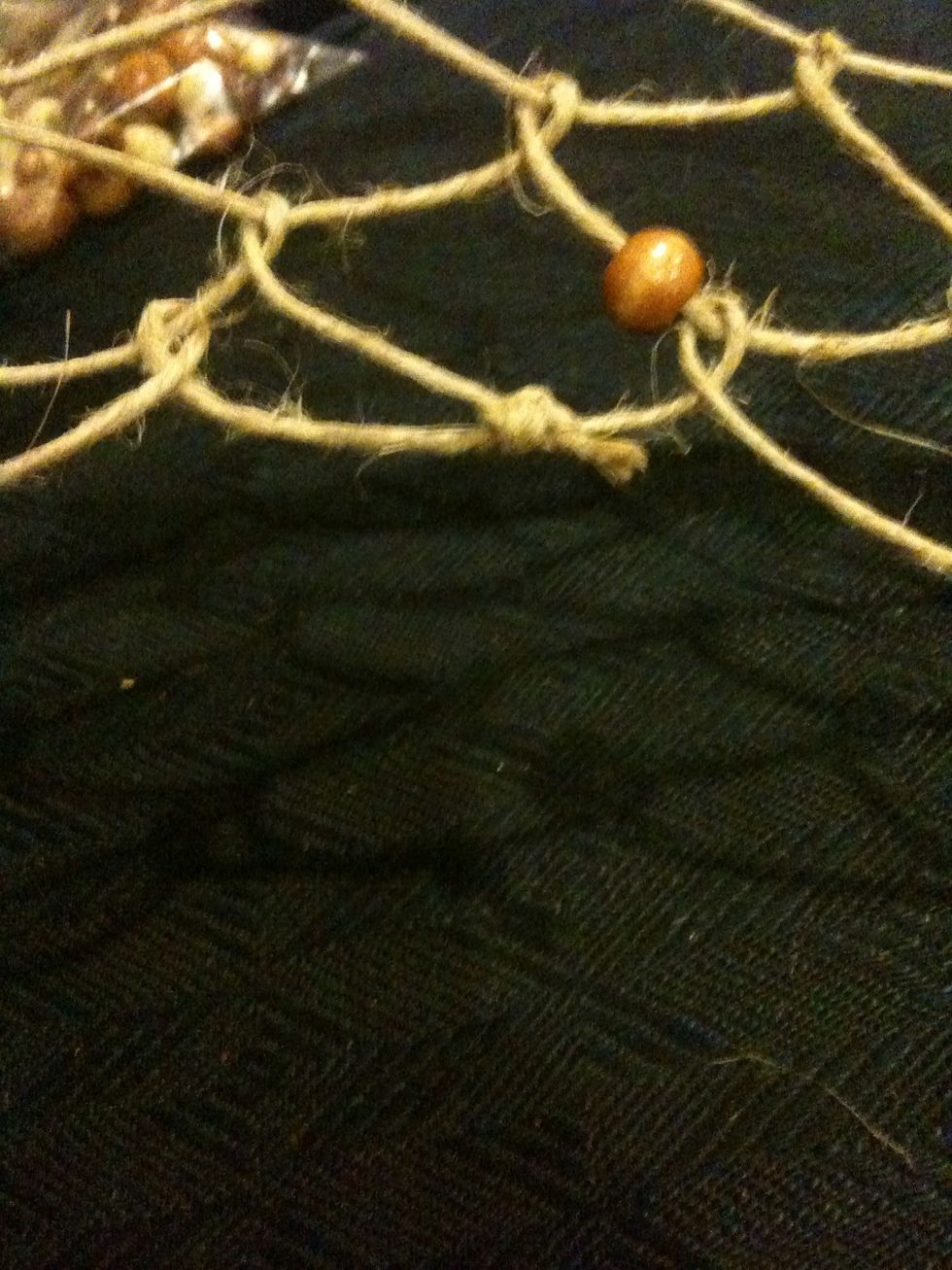 Take the remainder sinew and tie it in a know.