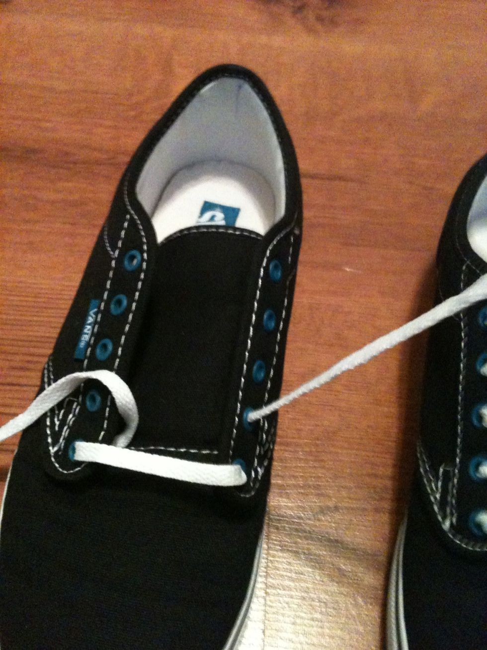 Take the right lace and pull it through the bottom of the second eye on the right side