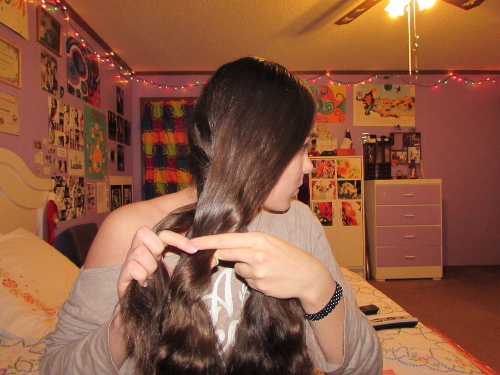 Take the right-most section and cross it over the middle.