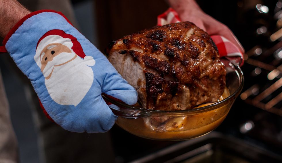Take the roast of the oven and drain the liquid into a sauce pan and remove the onions and citrus. Then replace the pork into the pan and continue cooking for another 15 minutes at 350F
