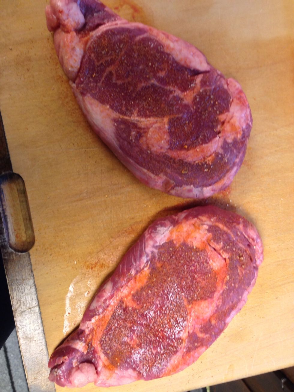 Take the rub ( ill show you how to make the rub later) and lightly sprinkle it over the ribeyes. Then RUB it in. Not to hard, for the ribeye is quite tender, and may rip apart if you're too rough.