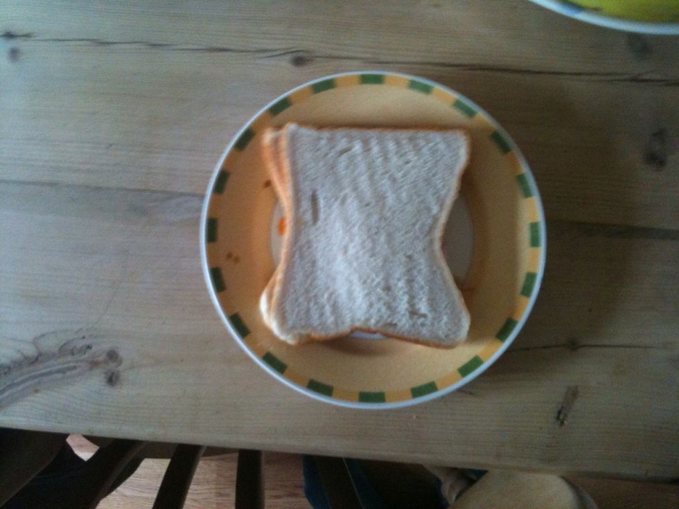 Take the second slice of cheese and put it on the top of the first slice
