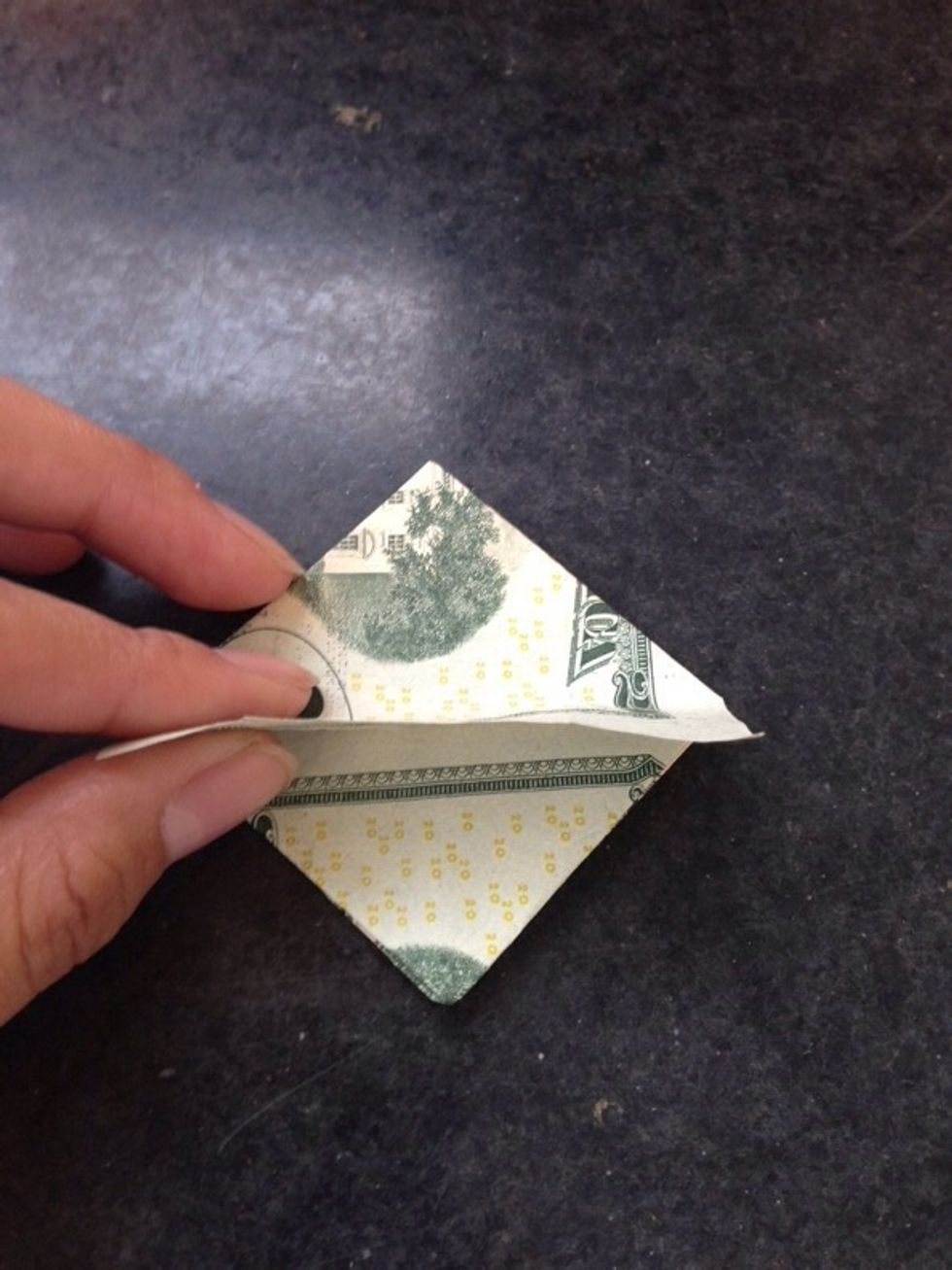 Take the small flap and fold up