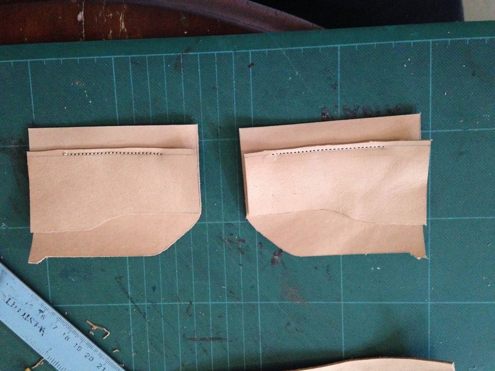 Take the small part and alligned them together and sew on the mark previosly made and cut the excess leather